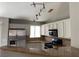 Spacious kitchen with stainless steel refrigerator, granite counters, and modern track lighting at 1712 Matador Way, Las Vegas, NV 89128