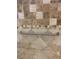 Shower with accessible hand rail and beige patterned tilework at 1712 Matador Way, Las Vegas, NV 89128
