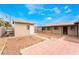 Wide backyard featuring a shed and large patio. Desert landscaping for minimal maintenance at 1733 N Michael Way, Las Vegas, NV 89108