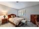 Cozy bedroom with a queen-size bed, classic wood furniture, and neutral decor at 1733 N Michael Way, Las Vegas, NV 89108