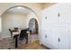 Dining room featuring tile floors, an arched entryway, and built in cabinets at 1733 N Michael Way, Las Vegas, NV 89108