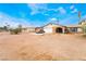 Charming single-story home featuring a two-car garage, a stone-accented entryway and desert landscaping at 1733 N Michael Way, Las Vegas, NV 89108