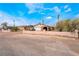 Single-story home with desert landscaping and a front yard with mature trees and bushes at 1733 N Michael Way, Las Vegas, NV 89108