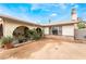 Single-story home with desert landscaping and a front yard at 1733 N Michael Way, Las Vegas, NV 89108