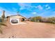 Single-story home with desert landscaping and mature foliage in front at 1733 N Michael Way, Las Vegas, NV 89108