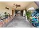 A covered front porch of a home with desert landscaping and a decorative stone wall at 1733 N Michael Way, Las Vegas, NV 89108