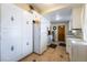 An outdated kitchen with tile floor, white cabinets, and vintage hardware at 1733 N Michael Way, Las Vegas, NV 89108