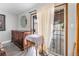 A main bedroom with a vintage dresser and a sliding glass door to the backyard at 1733 N Michael Way, Las Vegas, NV 89108
