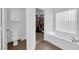 Bathroom with toilet, bathtub, shower, and walk-in closet access at 1893 Donnington Ct, Las Vegas, NV 89123