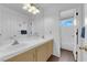 Bathroom features dual sinks, tile countertops, and a shower/tub combo at 1893 Donnington Ct, Las Vegas, NV 89123