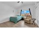 Bright bedroom featuring a ceiling fan, closet, and a comfortable chair at 1893 Donnington Ct, Las Vegas, NV 89123