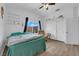 Bright bedroom with a ceiling fan, shelving, closet, chair and nice window views at 1893 Donnington Ct, Las Vegas, NV 89123