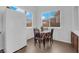 Bright dining area with table and chairs, adjacent to the kitchen, with bright windows at 1893 Donnington Ct, Las Vegas, NV 89123