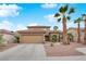 Charming home featuring a two-car garage, desert landscaping, and a tile roof at 1893 Donnington Ct, Las Vegas, NV 89123