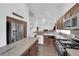 Well-equipped kitchen with stainless steel appliances, center island, and ample counter space at 1893 Donnington Ct, Las Vegas, NV 89123