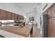 Kitchen featuring stainless steel appliances, wood cabinets, an island, and a dining table at 1893 Donnington Ct, Las Vegas, NV 89123