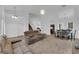 Spacious living room featuring plush carpeting and abundant natural light at 1893 Donnington Ct, Las Vegas, NV 89123