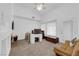 A spacious living room features a fireplace, a tan sofa, and a desk at 1893 Donnington Ct, Las Vegas, NV 89123