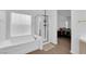 Bright main bathroom with shower and bathtub at 1893 Donnington Ct, Las Vegas, NV 89123