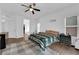 The main bedroom features a ceiling fan and wood-style flooring at 1893 Donnington Ct, Las Vegas, NV 89123