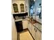 Charming wet bar features granite countertops, sleek cabinetry, and is perfect for entertaining guests at 2016 Catalina Marie Ave, Henderson, NV 89074