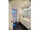 Modern bathroom features dual sinks, white cabinetry, and a separate shower room at 2016 Catalina Marie Ave, Henderson, NV 89074