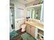 Bright bathroom featuring a walk-in shower, a toilet, and a vanity with a tile countertop at 2016 Catalina Marie Ave, Henderson, NV 89074
