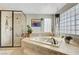Luxurious bathroom featuring a soaking tub, separate shower, and stylish accents at 2016 Catalina Marie Ave, Henderson, NV 89074
