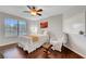 Bright bedroom features a ceiling fan, large window, and comfortable furnishings at 2016 Catalina Marie Ave, Henderson, NV 89074
