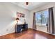 Bright bedroom featuring a desk, wood floors, and ample natural light at 2016 Catalina Marie Ave, Henderson, NV 89074