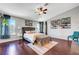 Comfortable bedroom with hardwood floors, a ceiling fan, and large windows providing ample light at 2016 Catalina Marie Ave, Henderson, NV 89074