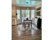 Breakfast nook area with natural light, wood floors, and view of pool and backyard at 2016 Catalina Marie Ave, Henderson, NV 89074