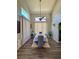 Formal dining area with high ceilings, neutral paint, window, and dark wood floors at 2016 Catalina Marie Ave, Henderson, NV 89074
