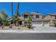 Charming two-story home showcasing manicured landscaping and a spacious three-car garage at 2016 Catalina Marie Ave, Henderson, NV 89074