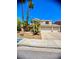 Expansive two-story home with a three-car garage and well-maintained front yard at 2016 Catalina Marie Ave, Henderson, NV 89074