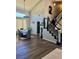 View of foyer, formal dining area, and staircase, with dark wood floors and high ceilings at 2016 Catalina Marie Ave, Henderson, NV 89074