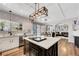 Well-lit kitchen boasts stainless steel appliances, a stylish island, and an open floor plan at 2016 Catalina Marie Ave, Henderson, NV 89074