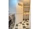 Laundry room area with modern washer and dryer, ample tile flooring, and cabinetry at 2016 Catalina Marie Ave, Henderson, NV 89074