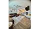 Inviting living room with a cozy fireplace, modern ceiling fan, and breakfast bar perfect for entertaining at 2016 Catalina Marie Ave, Henderson, NV 89074