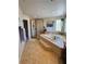 Luxurious main bathroom features a separate shower, large soaking tub, and stylish tile throughout at 2016 Catalina Marie Ave, Henderson, NV 89074