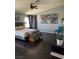 Cozy main bedroom with wood floors, natural light, and decorative wall art at 2016 Catalina Marie Ave, Henderson, NV 89074