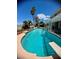 Stunning pool with clear blue water, diving board, and a shaded patio area at 2016 Catalina Marie Ave, Henderson, NV 89074