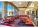 Spacious game room area with tables, chairs, and large windows with a lot of light at 2158 Alyssa Jade Dr, Henderson, NV 89052