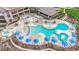 Resort-style pool area with ample lounge chairs, tables, and umbrellas at 2158 Alyssa Jade Dr, Henderson, NV 89052