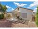 Well-maintained backyard features a covered patio, BBQ and desert landscaping at 2158 Indigo Creek Ave, Henderson, NV 89012