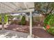 Beautiful backyard with covered patio and lush landscaping at 2158 Indigo Creek Ave, Henderson, NV 89012