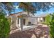 Serene backyard featuring a covered patio and lush greenery, perfect for outdoor enjoyment at 2158 Indigo Creek Ave, Henderson, NV 89012