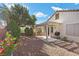 Large backyard with a covered patio and exterior access to home at 2158 Indigo Creek Ave, Henderson, NV 89012