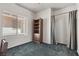 Bedroom featuring gray carpet, a large window, and a brown bookshelf at 2158 Indigo Creek Ave, Henderson, NV 89012