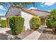 Inviting front yard with lush landscaping and a walkway leading to the charming entrance at 2158 Indigo Creek Ave, Henderson, NV 89012